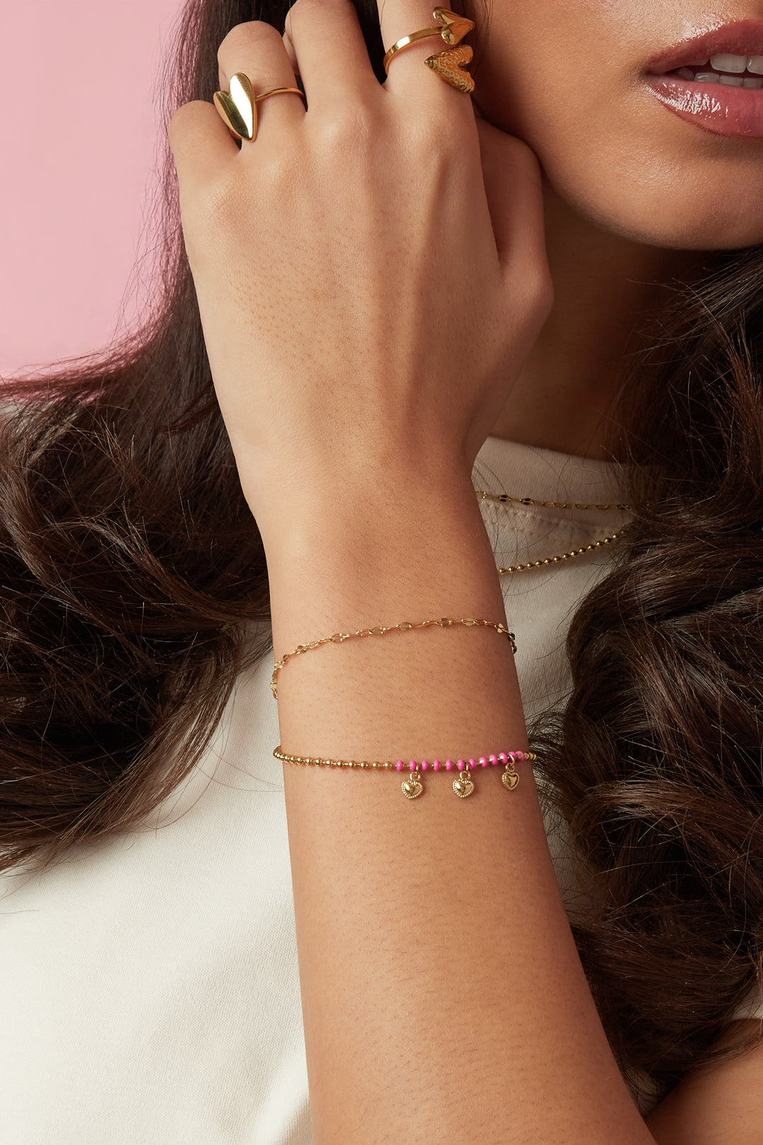 Dubbele armband met kralen en hartjes charms