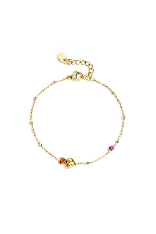 Armband met hartjes, gekleurde steentjes en stipjes